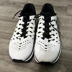 White and black Nike shoes 15W
